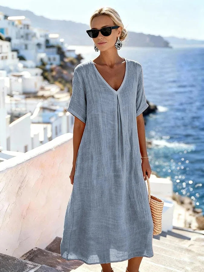 Flowy Women's Relaxed Fit Midi Dress, featuring practical short sleeves and a flattering V-neck.