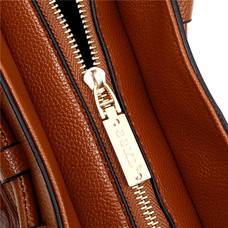 Classic brown croc embossed women's handbag, versatile for any occasion, elegant accessory.