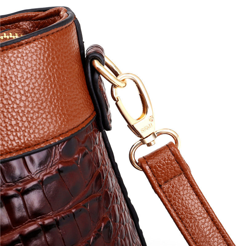 Red faux leather croc embossed vintage shoulder bag, a fashionable women's accessory.