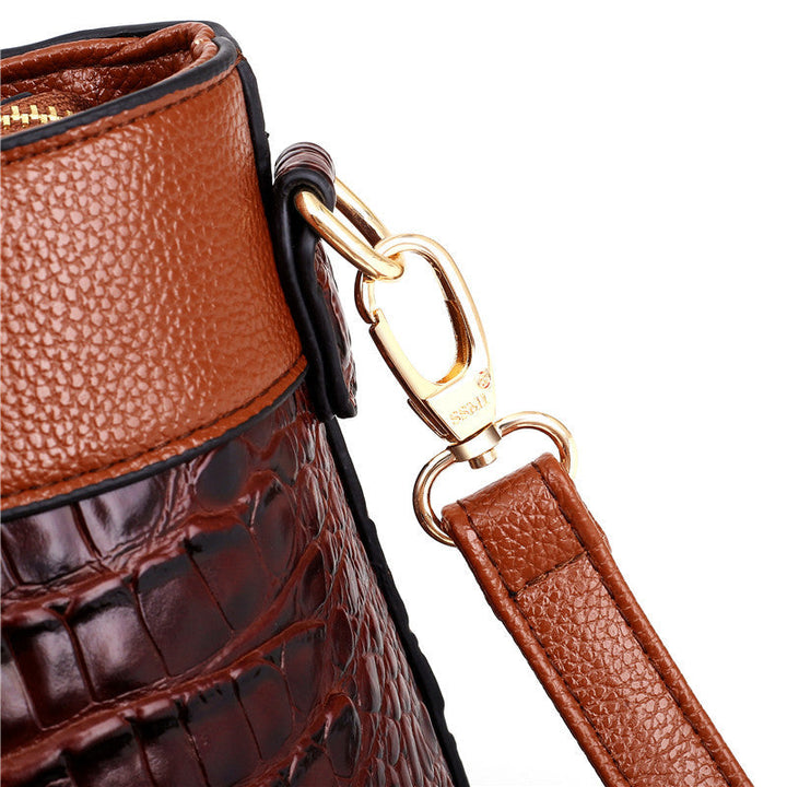Red faux leather croc embossed vintage shoulder bag, a fashionable women's accessory.
