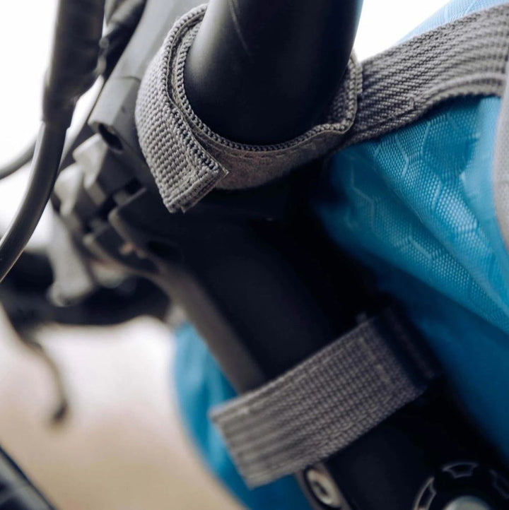 Durable waterproof bike handlebar bag for secure storage and easy phone access while cycling.
