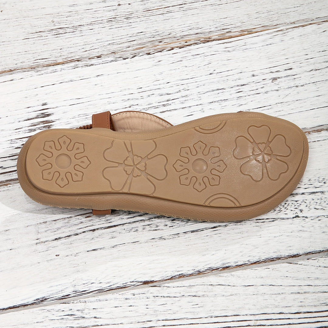 Chic women's flat summer sandals with intricate rhinestone and beadwork, comfortable and fashionable.