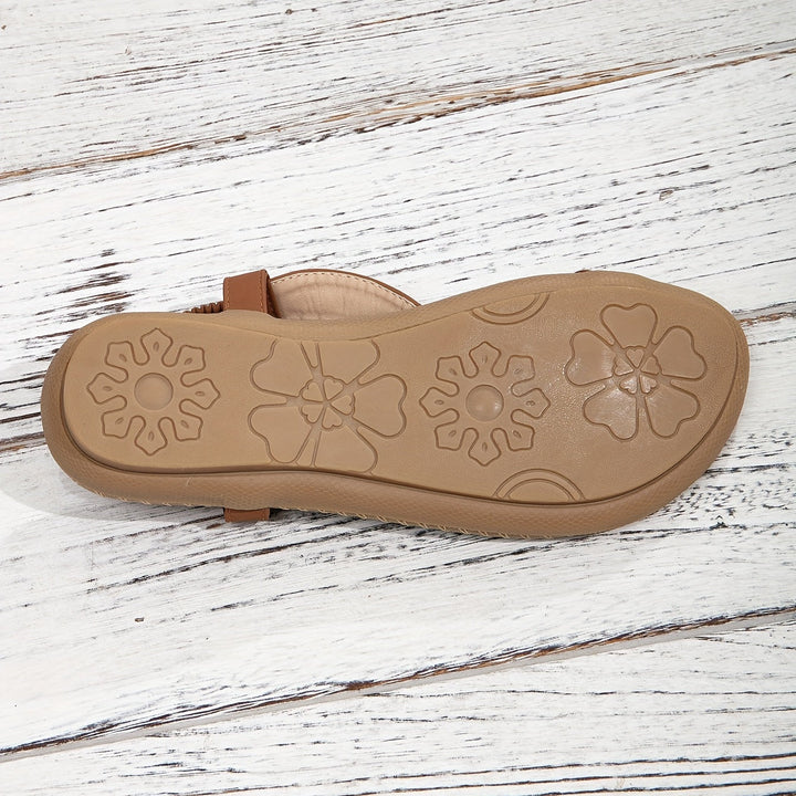 Chic women's flat summer sandals with intricate rhinestone and beadwork, comfortable and fashionable.
