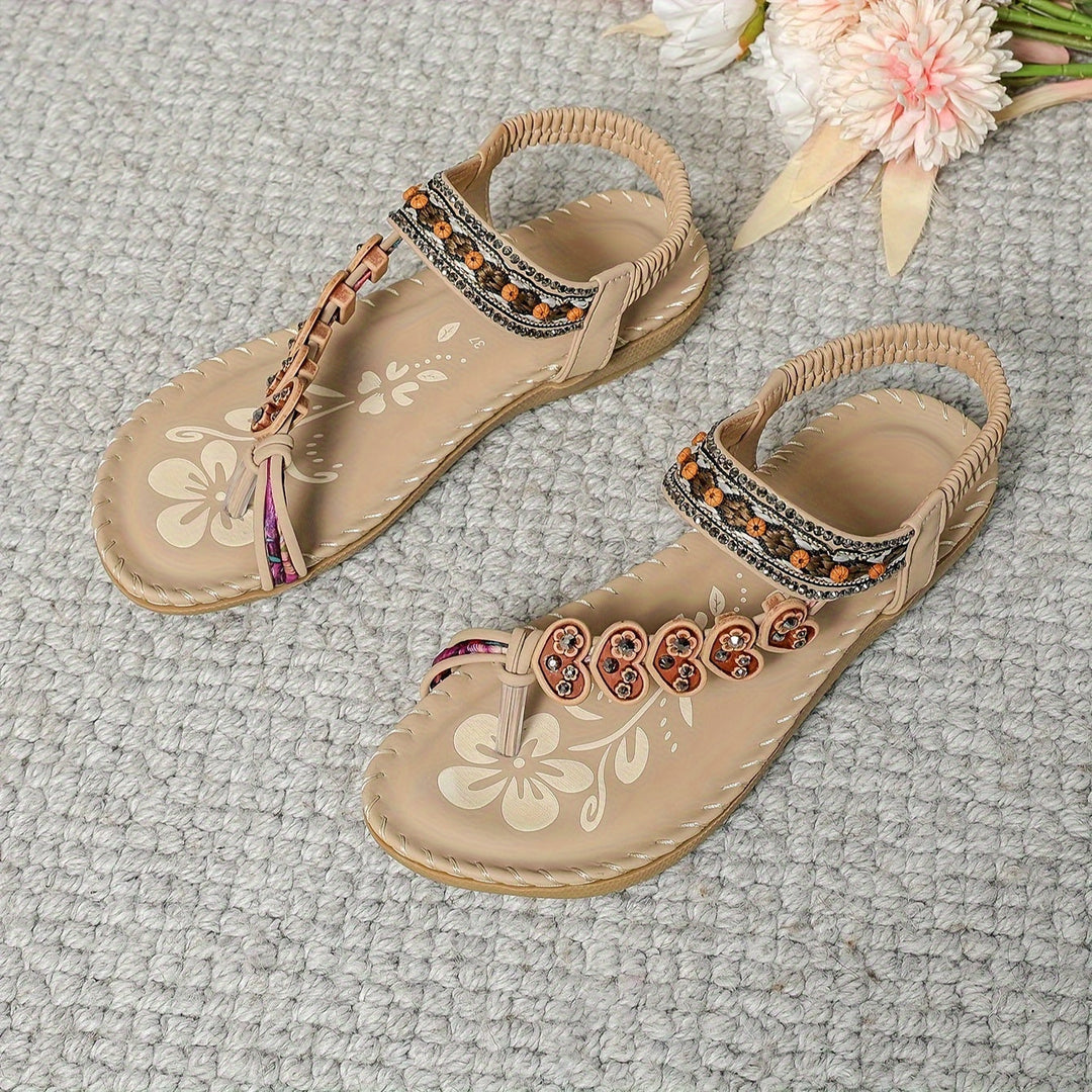 Side view of women's flat boho sandals, showcasing rhinestone and beaded embellishments.