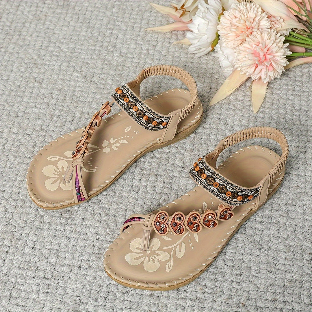Pair of Women's Boho Rhinestone Beaded Flat Sandals, perfect for beach or casual summer outings.