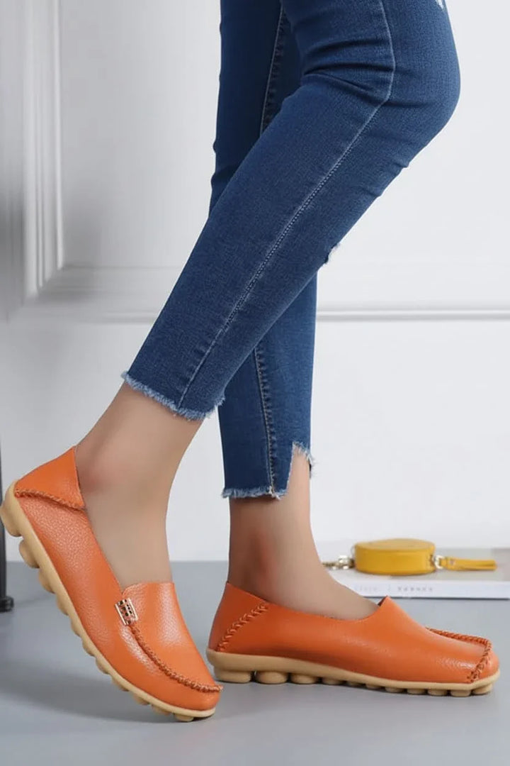 Stylish slip-on women's round toe flats, perfect for versatile casual and professional looks.
