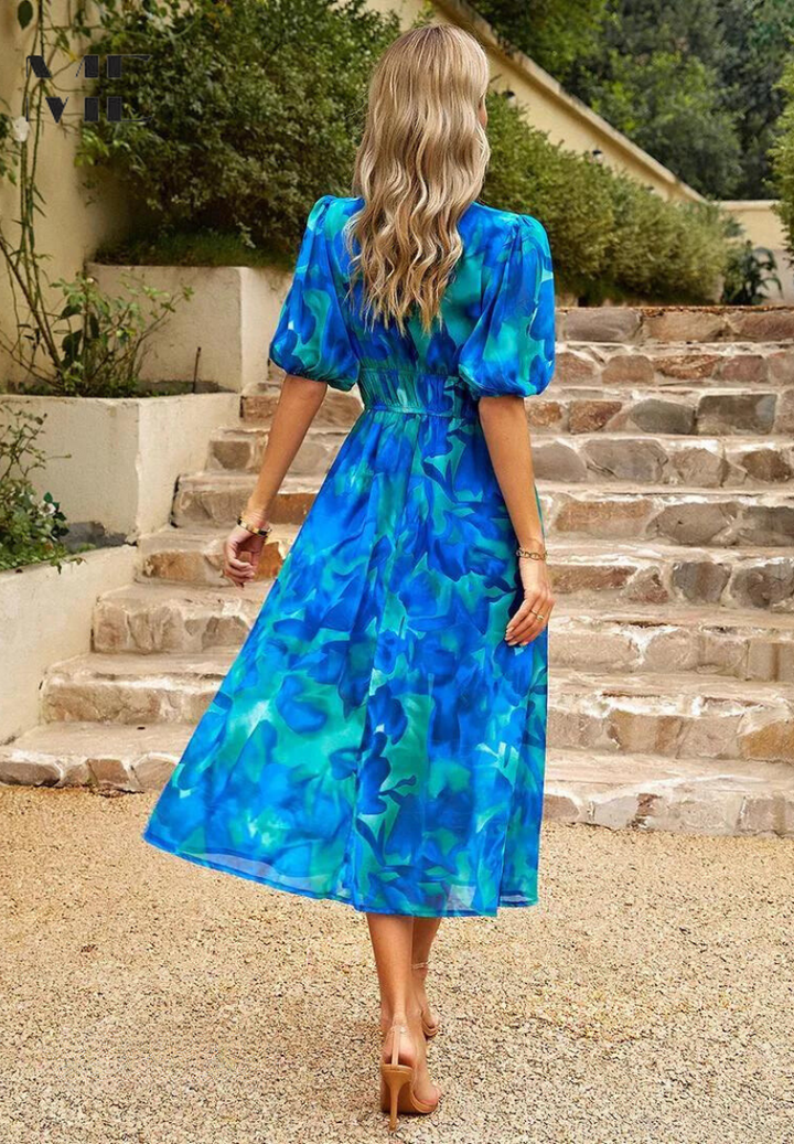 Beautiful floral patterned V-Neck Midi Dress for women, a colorful addition to spring/summer wardrobe.