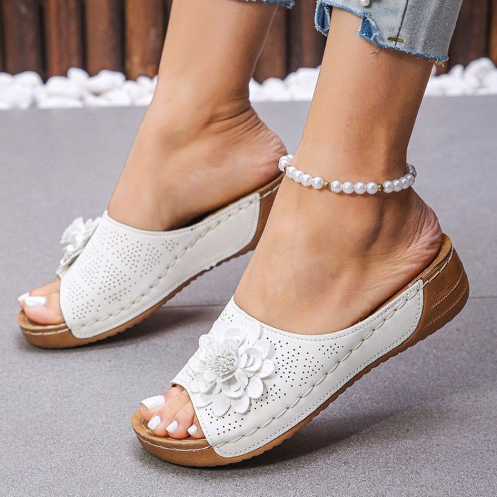 Pair of slip-on women's comfort sandals, ideal for arch support & everyday wear.