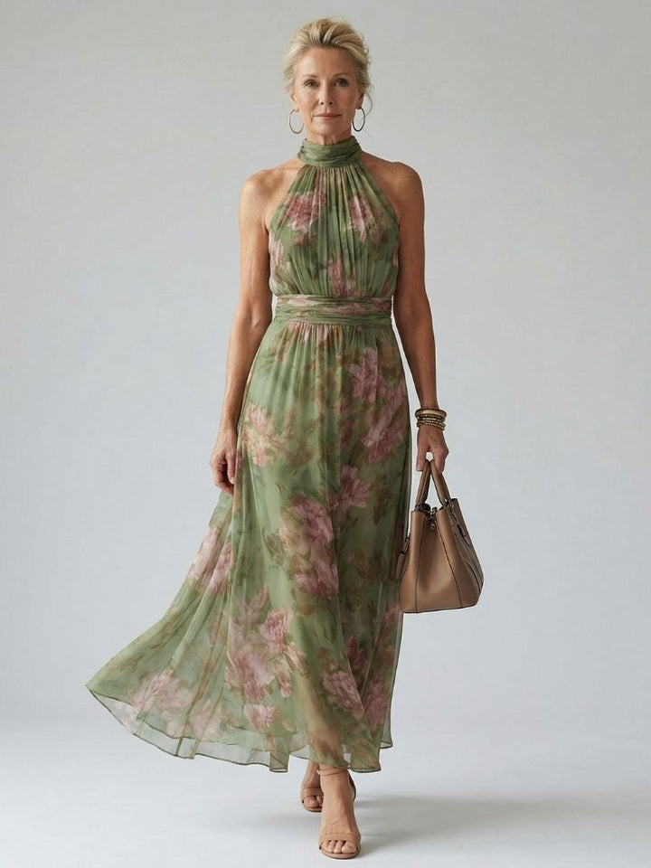 Women's green halter midi dress with elegant floral print. A perfect summer sundress for warm weather.