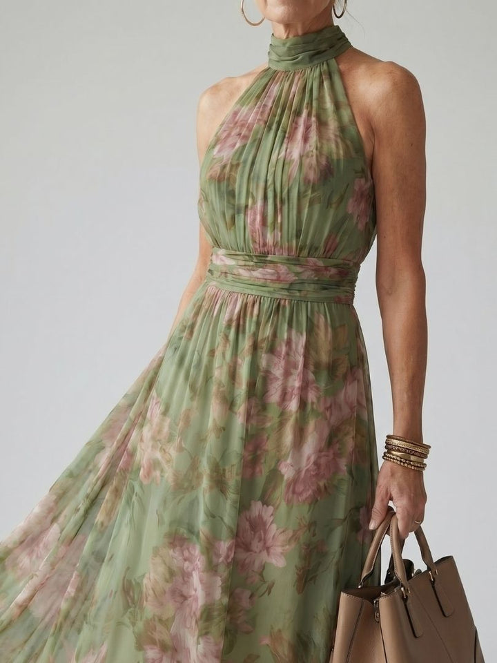 Elegant women's green floral print halter midi dress. Ideal summer sundress for warm weather occasions.