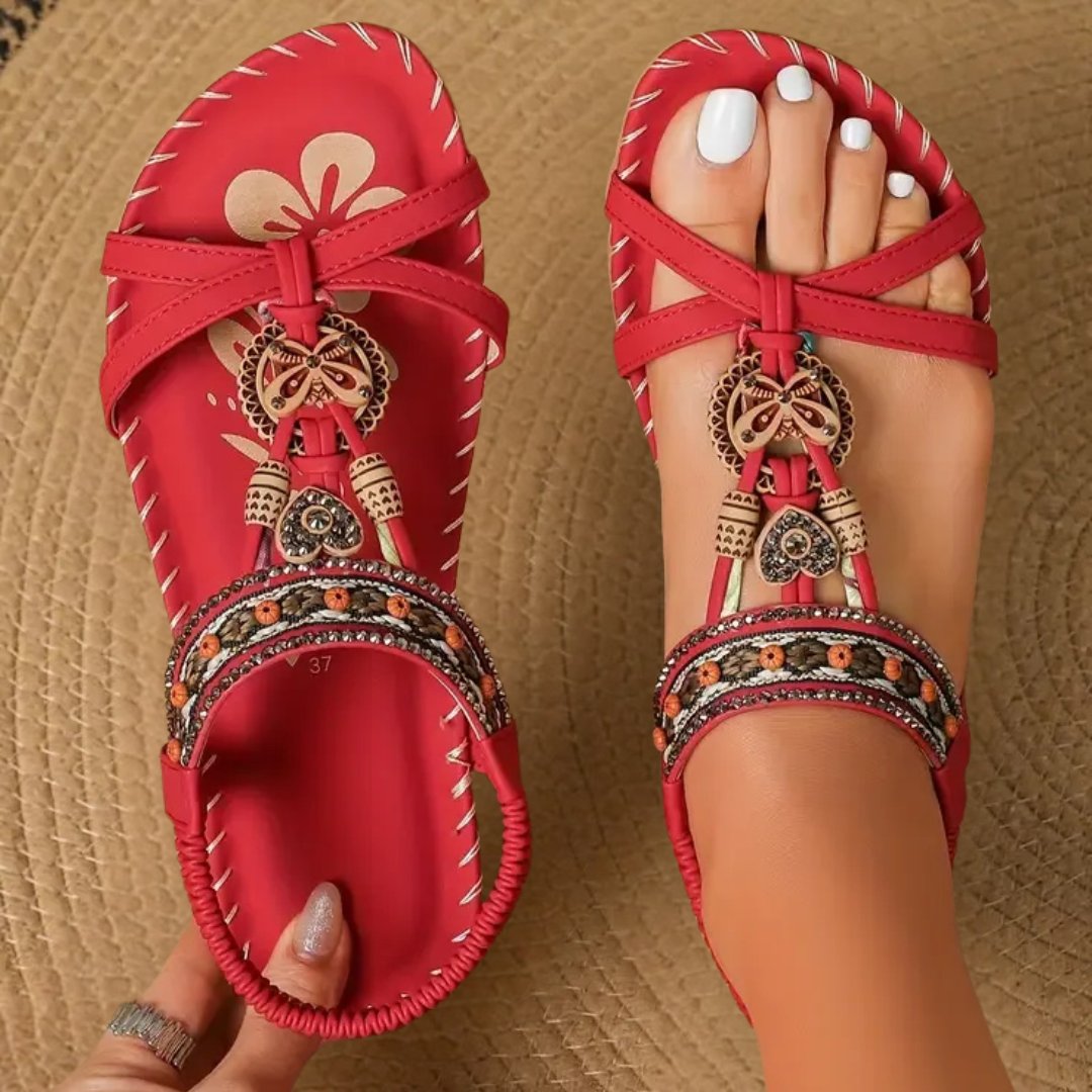 Stylish women's flat t-strap sandals with orthopedic support, ideal for everyday boho fashion.