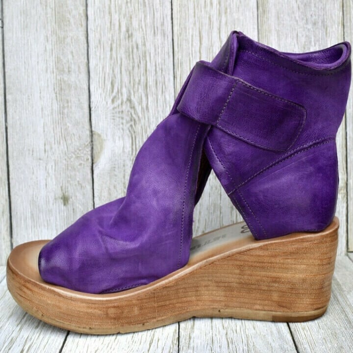 Back view of comfortable women's boho wedge sandals, featuring a trendy wedge and sturdy design.