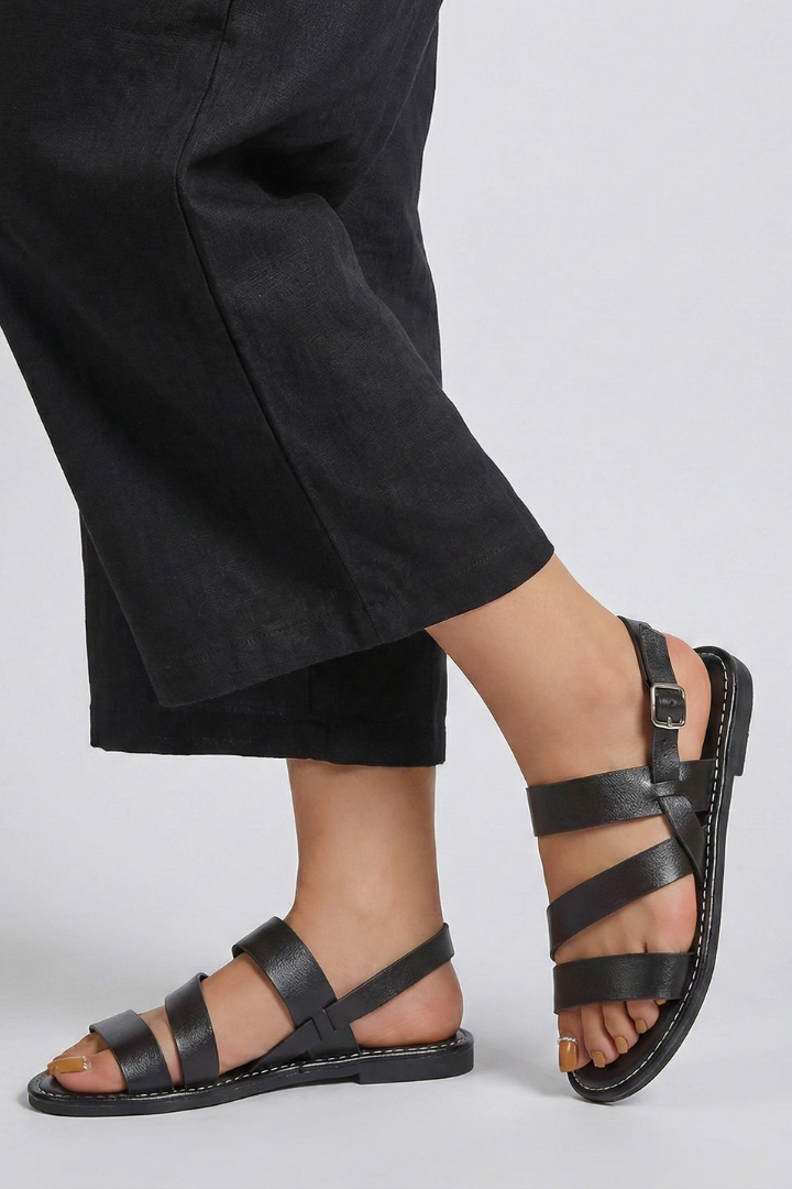 Elegant women's flat sandals with a supportive back strap, offering comfortable summer wear.