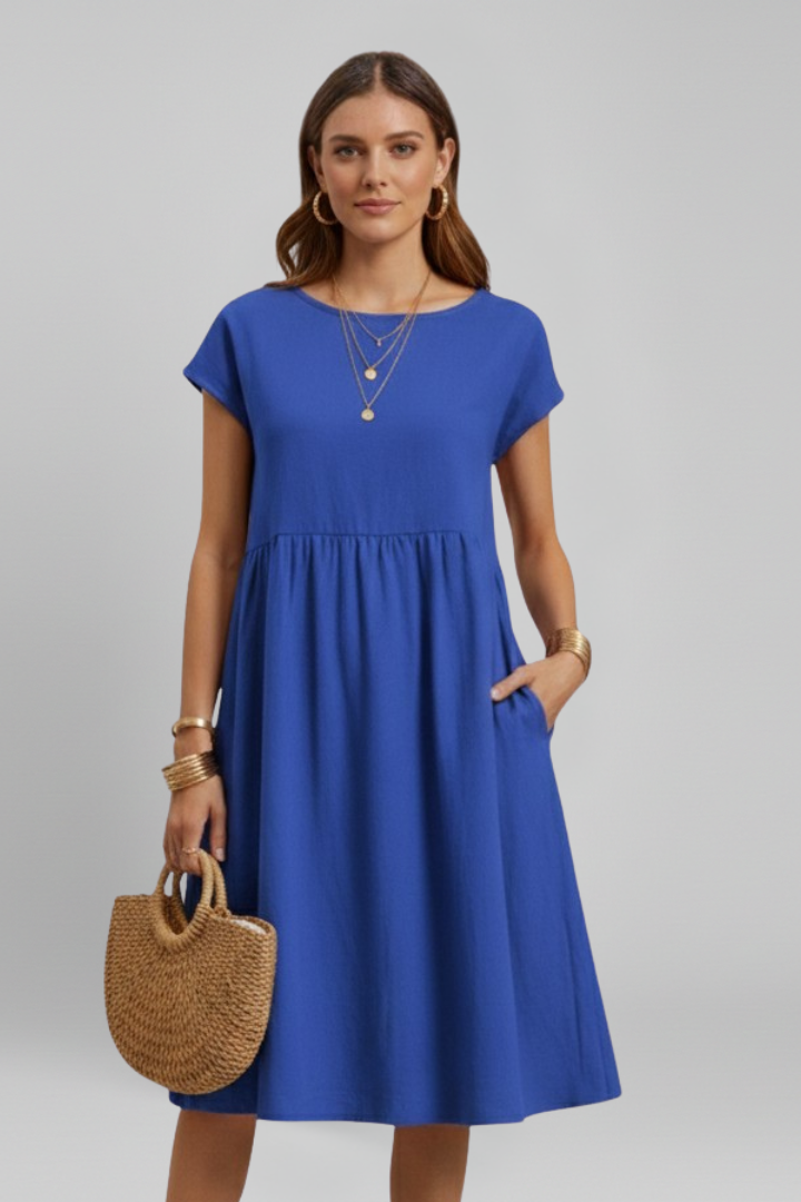 Comfort-first women's knee-length dress with round neck, short sleeves, and discreet side pockets.