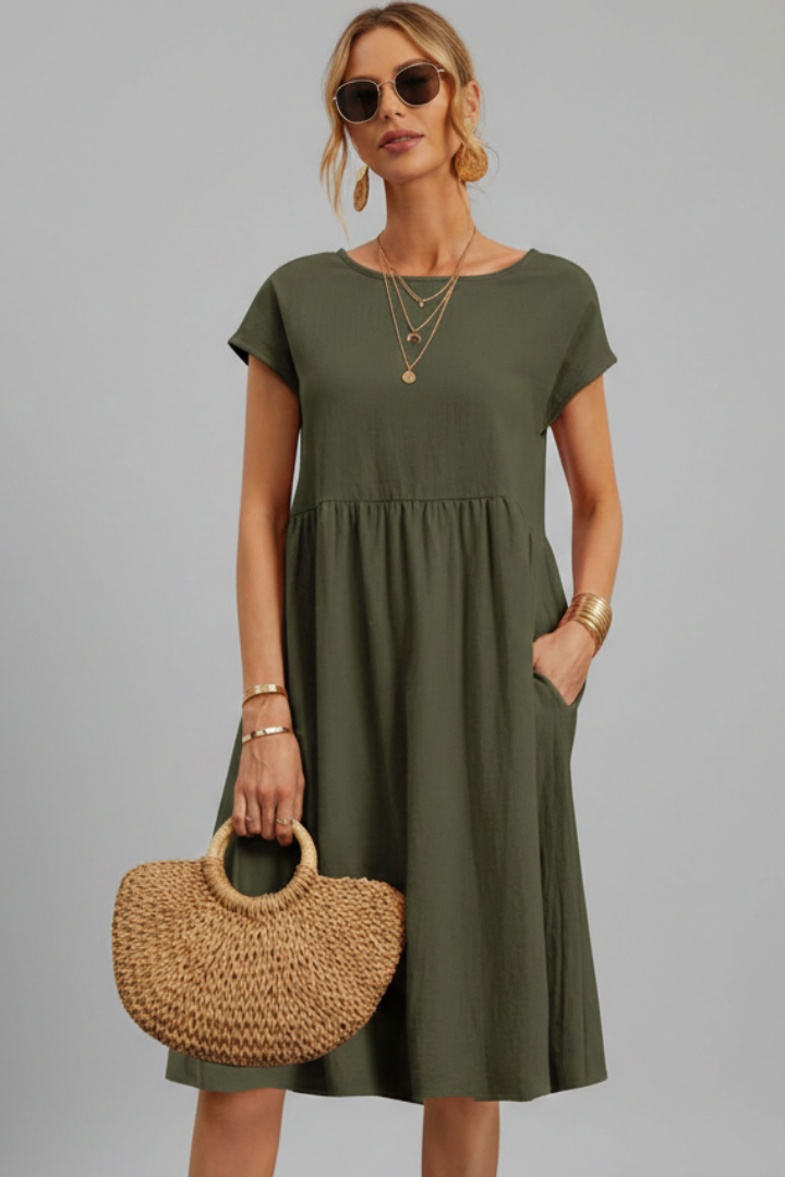 Go-to women's casual knee-length dress with a flattering fit, round neck, short sleeves, and pockets.