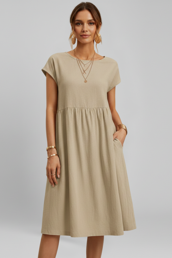 Versatile women's knee-length dress with a round neck, short sleeves, and practical side pockets.