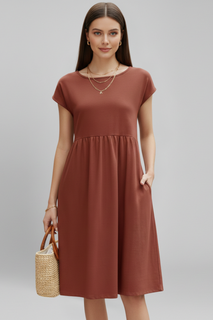 Chic women's everyday knee-length dress with a classic round neck, short sleeves, and functional pockets.