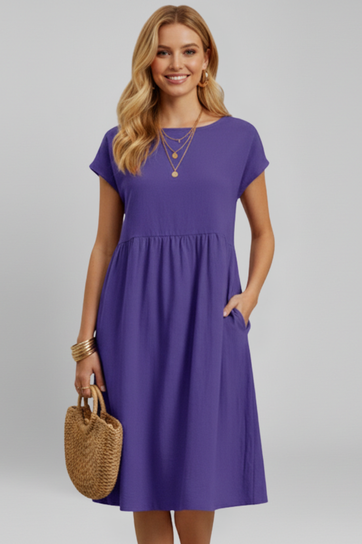 Stylish women's knee-length dress, perfect for casual wear, with round neck, short sleeves & pockets.