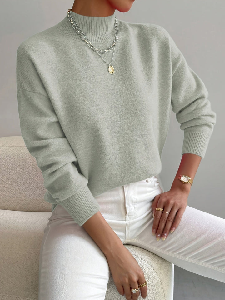 Comfortable women's mock neck knit sweater in a versatile spring color, ideal for casual wear.