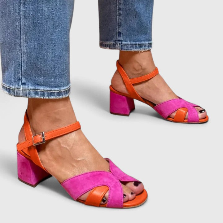 Comfortable women's pink wedge heel sandals with adjustable strap, perfect for casual summer wear.