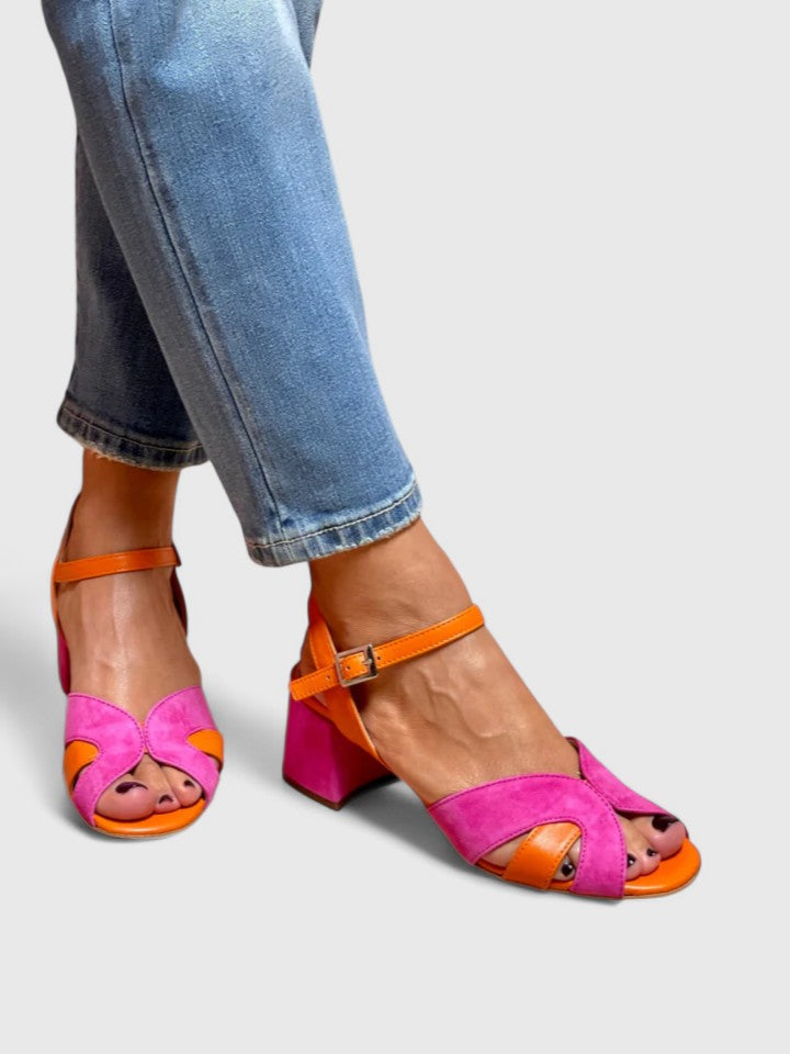 Women's pink casual sandals featuring a comfortable wedge heel and adjustable strap, ideal for daily summer wear.