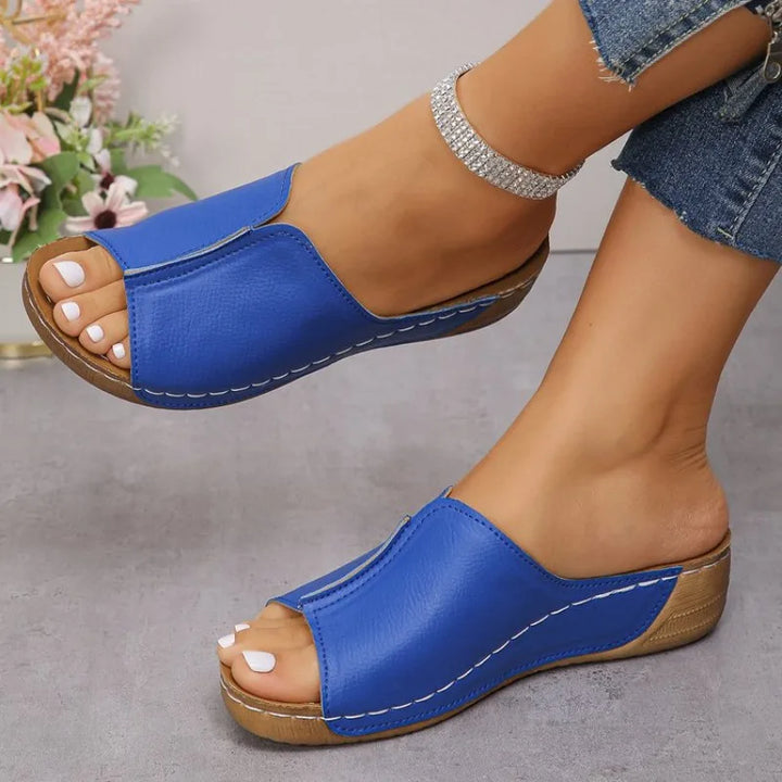 Women's casual outdoor footwear: slip-on wedge platform sandals with a supportive, comfortable design.
