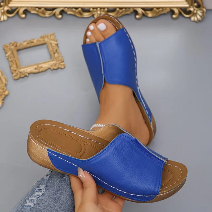 Chic women's wedge platform sandals with an effortless slip-on design, perfect for outdoor summer activities.