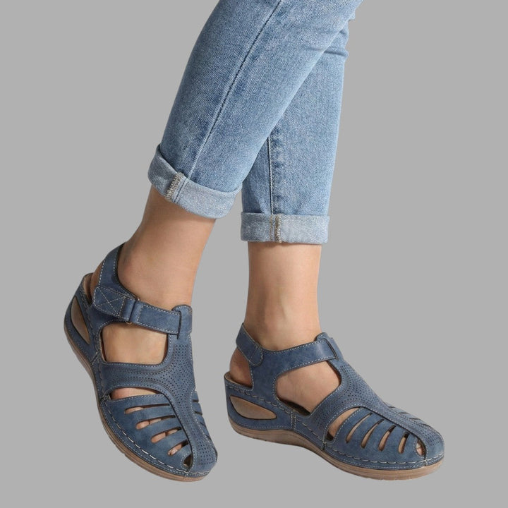 Breathable slip-on women's wedge sandals, offering comfortable support for casual summer footwear.