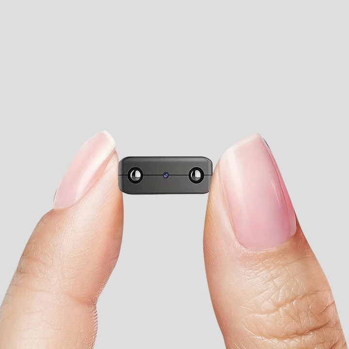 Compact mini surveillance camera with Full HD, motion detection & night vision for home security.