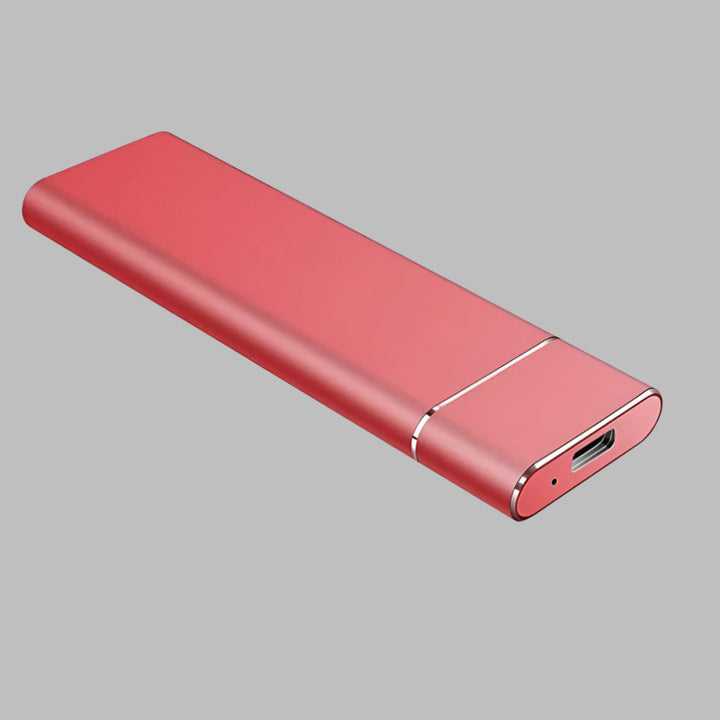 Portable external SSD for fast data backup, shown connected to a laptop for mobile storage on the go.