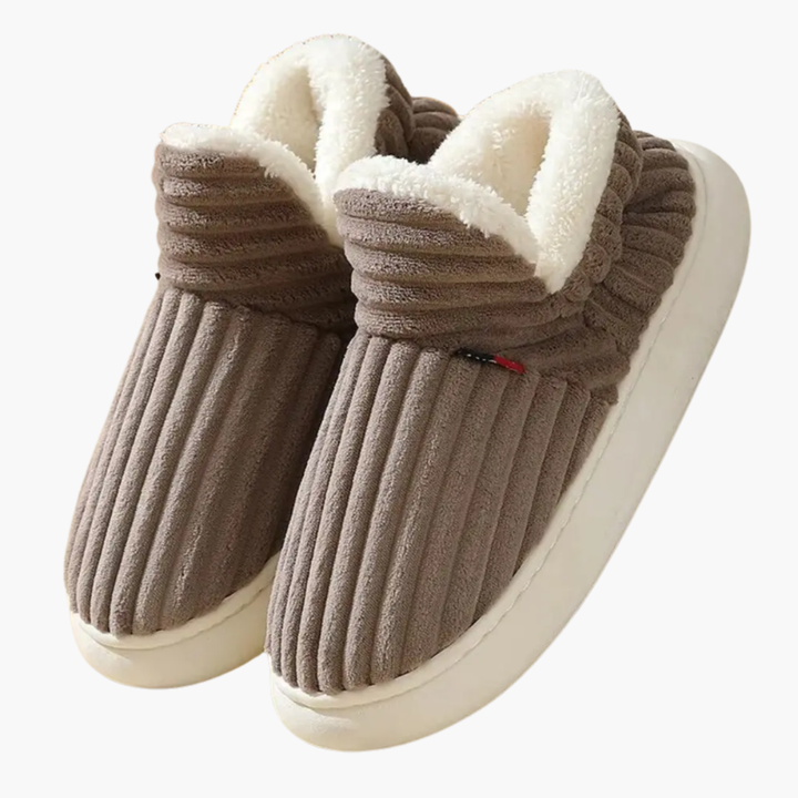 Plush ribbed women's cozy bootie slippers. Warm slip-on indoor shoes designed for ultimate home comfort.