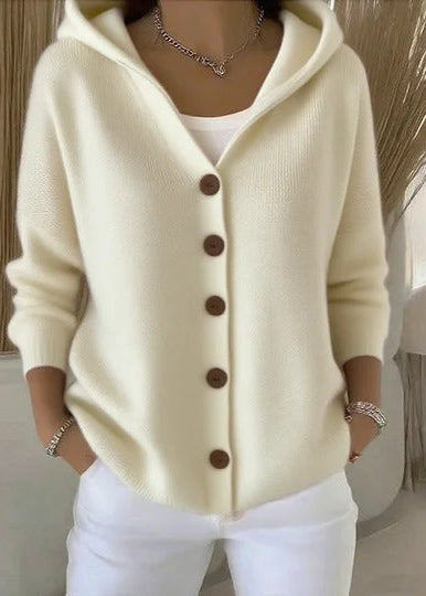 Warm women's hooded button-up cardigan featuring front pockets. Cozy fashion for fall & winter layering.