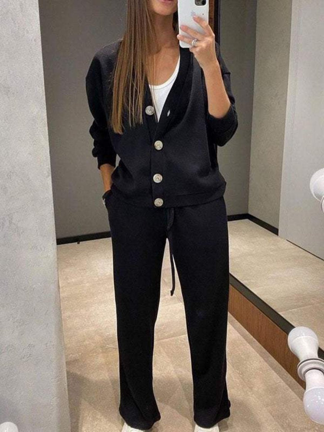 Women's two-piece casual outfit featuring a soft knit cardigan and matching drawstring pants for everyday style.