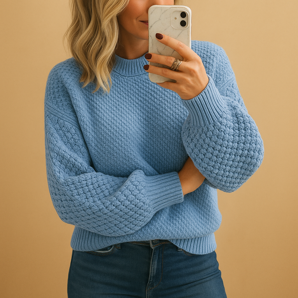 Stylish women's cream pullover sweater featuring a cozy textured knit for cooler weather.