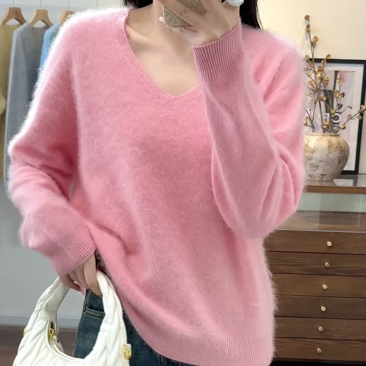 Warm women's V-neck sweater, an oversized, cozy top for relaxed autumn fashion.
