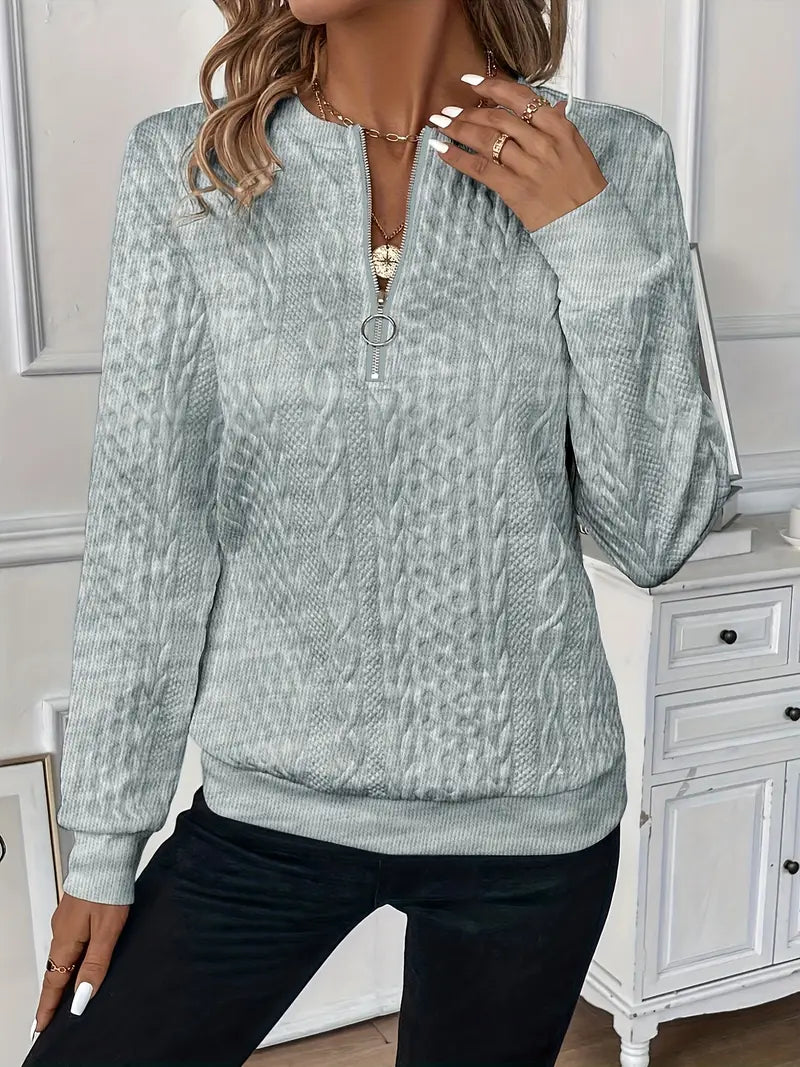 Warm women's zippered sweater, soft knitwear for cozy comfort during cooler weather.
