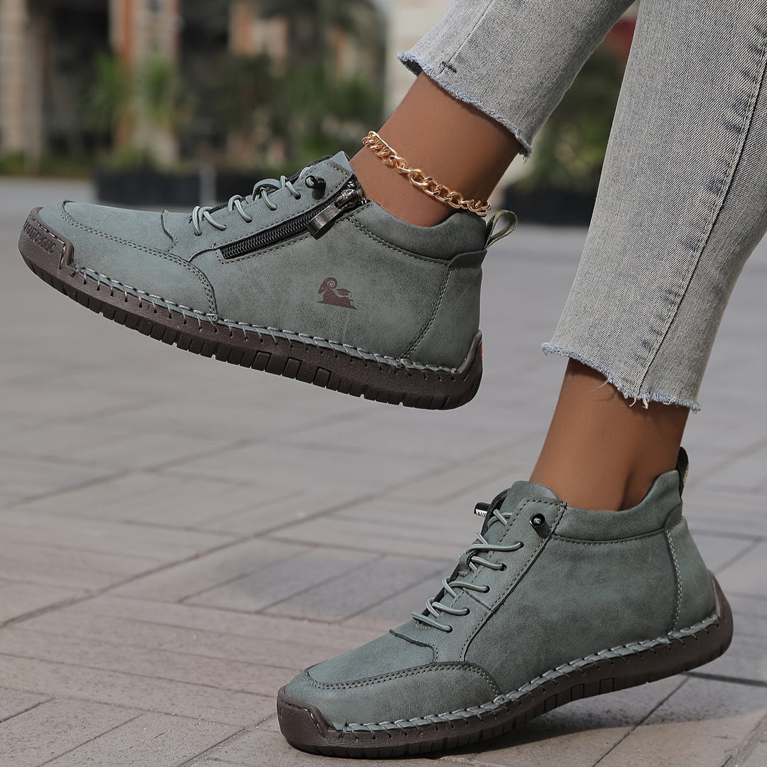 Black Danielle zip-up sneakers by Ash New York for everyday walking