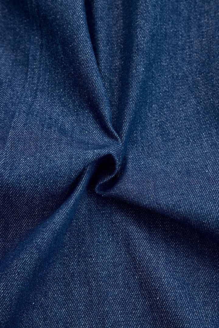 Versatile women's dark blue long sleeve wide leg jumpsuit, a comfortable and chic zip-front outfit.