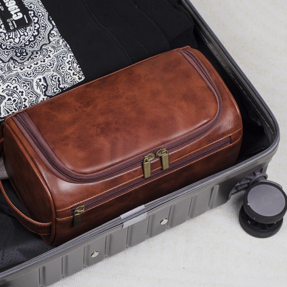 Stylish light brown men's travel organizer. Portable luxury toiletry bag for bathroom and grooming essentials.