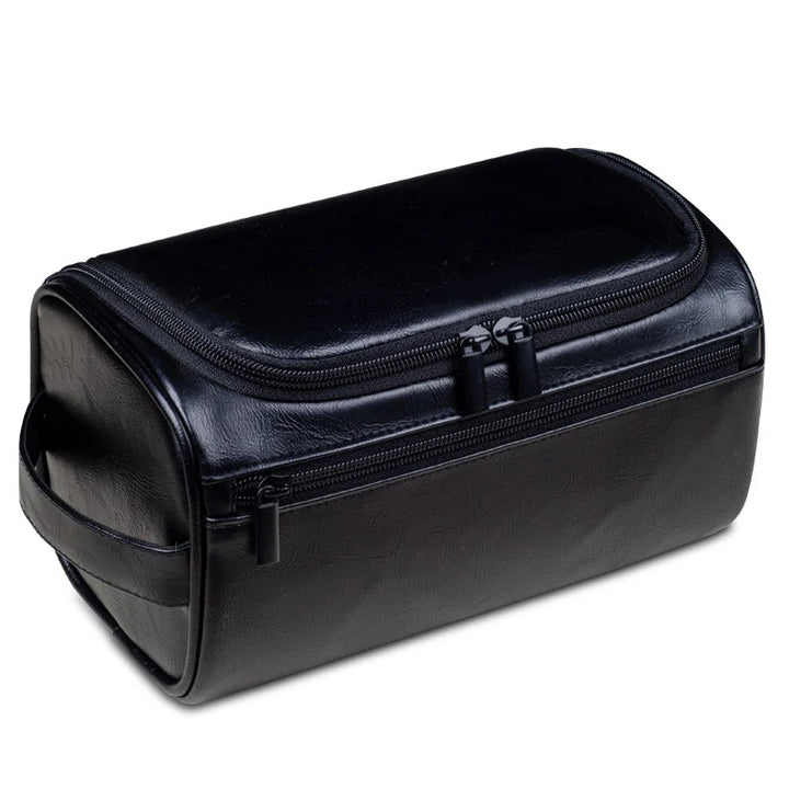 Light brown men's luxury travel toiletry bag, a waterproof dopp kit for travel and organized grooming essentials.