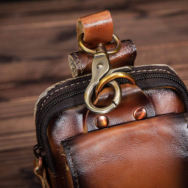 Active men's dark brown everyday carry waist bag, multi-pocket for travel and organization.