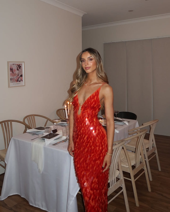 Glamorous red backless V-neck sequin dress for women, suited for any formal occasion.