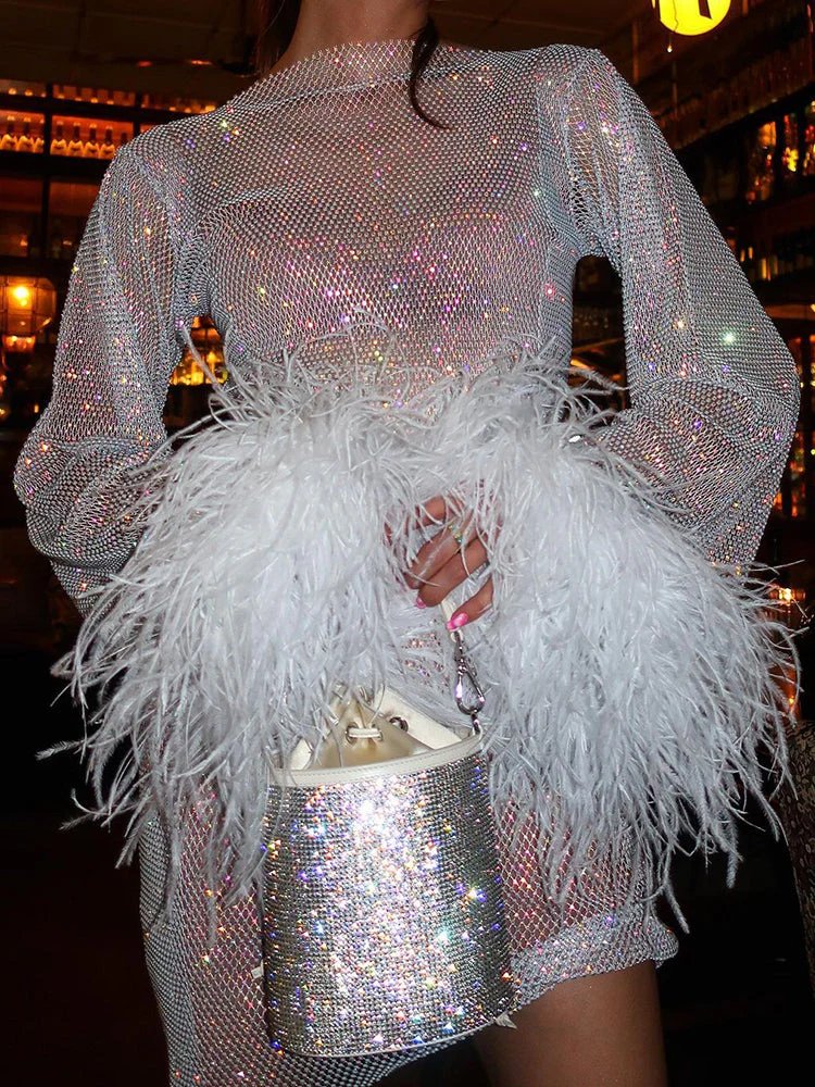 Glamorous bodycon long sleeve mini dress for women, featuring dazzling shimmer and elegant cuff details.