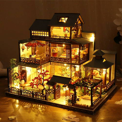 Intricately designed miniature wooden dollhouse, fully assembled with warm LED lighting, perfect display piece.