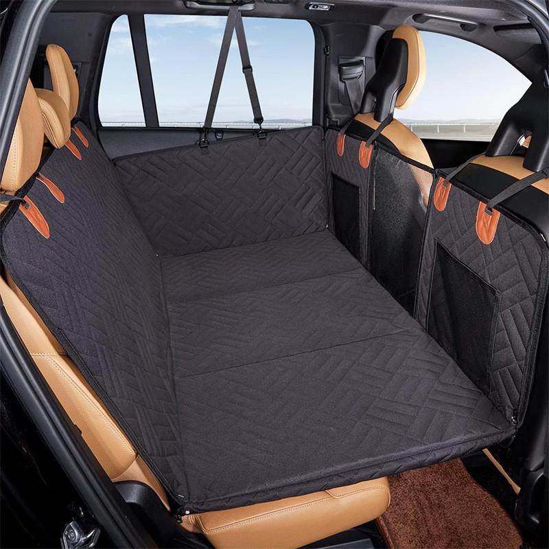 Heavy-duty dog hammock car seat protector with side flaps, a must-have waterproof pet travel supply.