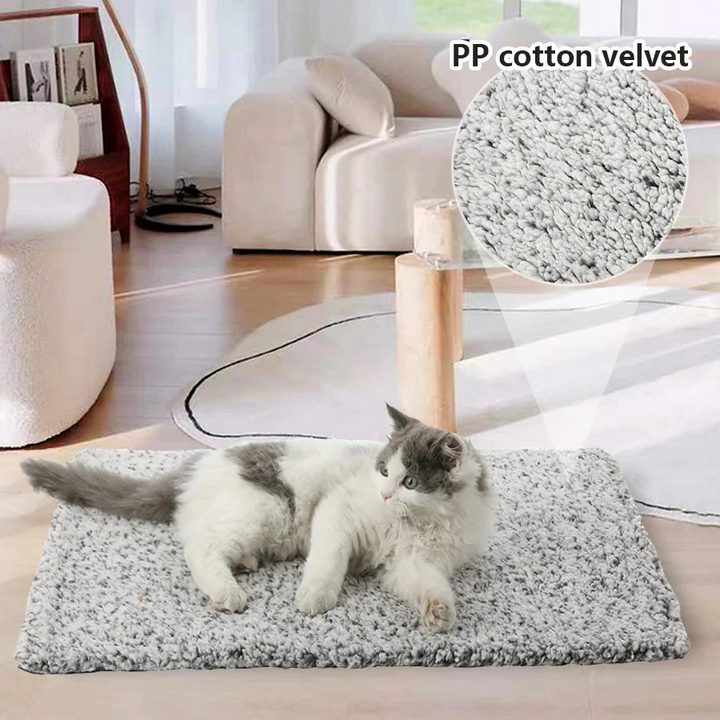 Warm & cozy self-heating pet pad. Non-electric mat for dog & cat comfort. Washable & durable.