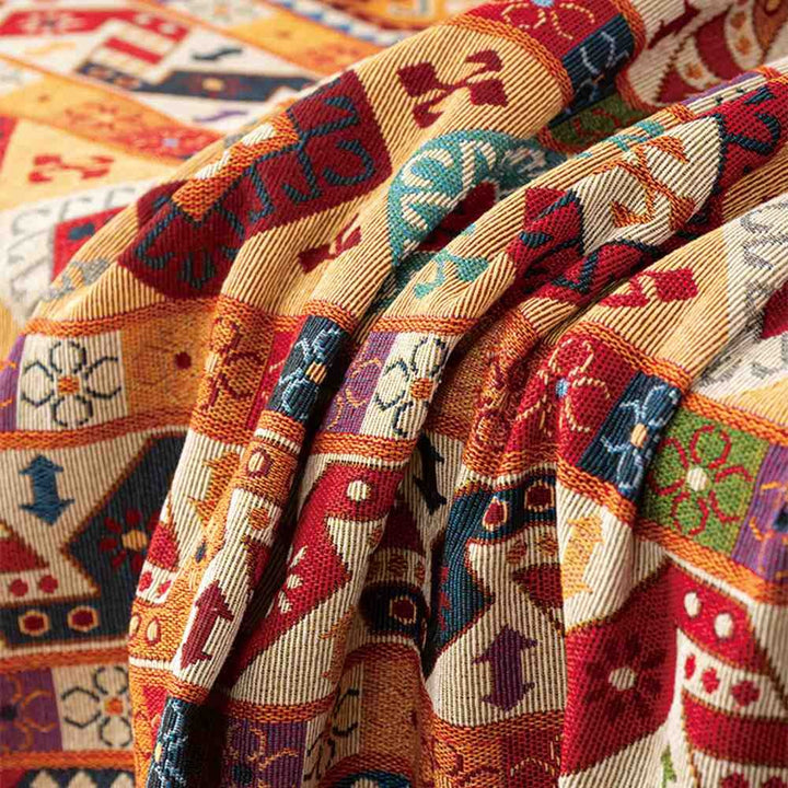 Comfortable Moroccan Jacquard throw blanket for living room or bedroom. Geometric woven home decor textile.