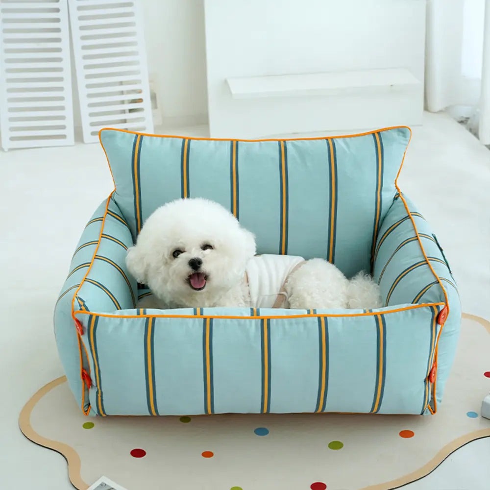 Comfortable gray dog sofa bed with high walls and removable, washable cover; perfect for cozy pet lounging.