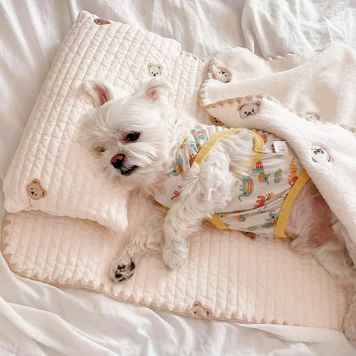 Cozy embroidered cotton pet bed set with pillow & quilt for small/medium dogs or cats. Washable & comfortable.