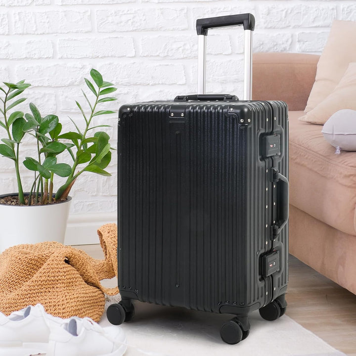 Black hardshell carry-on suitcase with silent, multi-directional spinner wheels & integrated TSA security lock for travel ease.